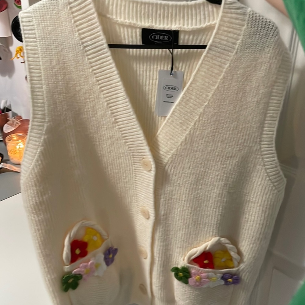 cider vest with flowers never worn brand new with tags:)